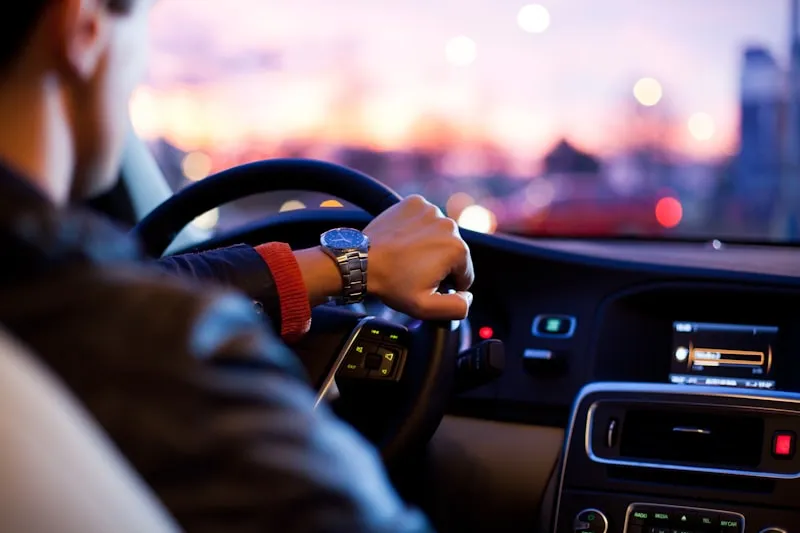 Driver holding a vehicle key fob
